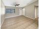 Bright living room with tile flooring and a ceiling fan at 110 Lindenwood Ln, Kissimmee, FL 34743