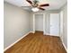 Bright bedroom with wood-look floors and a ceiling fan at 110 Lindenwood Ln, Kissimmee, FL 34743