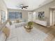 Bright living room with a sectional sofa and a large window at 110 Lindenwood Ln, Kissimmee, FL 34743