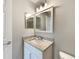 Clean bathroom with granite countertop and updated vanity at 110 Lindenwood Ln, Kissimmee, FL 34743