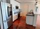 Modern kitchen with stainless steel appliances and white cabinets at 155 S Court Ave # 1801, Orlando, FL 32801