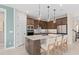 Kitchen island with seating and a view into the dining area at 4184 Winding Pines Dr, Apopka, FL 32712