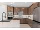 Modern kitchen with stainless steel appliances and white quartz countertops at 4184 Winding Pines Dr, Apopka, FL 32712