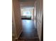 Hallway with dark hardwood floors leading to living room at 2860 N Powers Dr # 133, Orlando, FL 32818