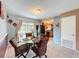 Dining area with glass table, four chairs, and kitchen views at 10332 Olcot St, Orlando, FL 32817