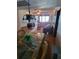 Dining area with a glass-top table and wicker chairs at 2301 S Atlantic Ave # 327, Daytona Beach, FL 32118