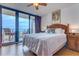 Ocean view bedroom with a king bed and sliding doors to a balcony at 2301 S Atlantic Ave # 327, Daytona Beach, FL 32118