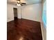 Spacious bedroom featuring hardwood floors and a large closet at 4901 Pleasant Hollow Trl, Lakeland, FL 33811