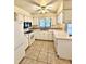 Efficient kitchen with white cabinets and tile floor at 4901 Pleasant Hollow Trl, Lakeland, FL 33811