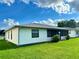 White single story home with screened porch and landscaped lawn at 4901 Pleasant Hollow Trl, Lakeland, FL 33811