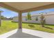 Covered patio with access to backyard at 957 King Parc Rd, Orange City, FL 32763