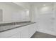 Double vanity bathroom with granite countertop and shower at 957 King Parc Rd, Orange City, FL 32763