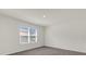 Well-lit bedroom with large window and neutral walls at 957 King Parc Rd, Orange City, FL 32763