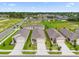 Aerial view of a row of houses in a residential community at 957 King Parc Rd, Orange City, FL 32763