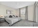 Spacious bedroom with a king-size bed and gray bedding at 875 Ocean Course Ave, Davenport, FL 33896