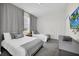 Guest bedroom with two twin beds and gray accents at 875 Ocean Course Ave, Davenport, FL 33896
