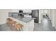 Modern kitchen with gray countertops, stainless steel appliances, and white cabinets at 875 Ocean Course Ave, Davenport, FL 33896
