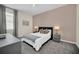 Bright bedroom featuring a comfortable bed and stylish decor at 875 Ocean Course Ave, Davenport, FL 33896