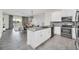 Modern kitchen with gray countertops, stainless steel appliances and white cabinets at 875 Ocean Course Ave, Davenport, FL 33896