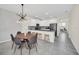 Modern kitchen with island, stainless steel appliances, and gray countertops at 875 Ocean Course Ave, Davenport, FL 33896