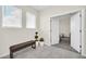 Bright hallway with a bench and view into bedroom at 875 Ocean Course Ave, Davenport, FL 33896