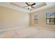 Main bedroom with carpeted floor and two windows at 2159 Bosque Aly, Orlando, FL 32814