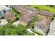 Aerial view of townhouses with tile roofs, near a park and other buildings at 2159 Bosque Aly, Orlando, FL 32814