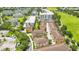 Aerial view of townhouses nestled amongst green spaces and other buildings at 2159 Bosque Aly, Orlando, FL 32814