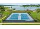 Two well-maintained tennis courts near lake at 12908 Creekside Ct, Clermont, FL 34711