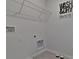 Laundry room with shelving, hookups, and dog bowls at 1708 Frogmore Ave, Haines City, FL 33844