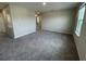 Spacious bedroom with plush carpeting and neutral walls at 1701 Andover Ridge Dr, Deland, FL 32720