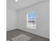 Simple bedroom with grey carpet and window at 4939 Worchester Dr, Kissimmee, FL 34746
