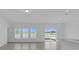 Living room with water view and sliding glass doors at 4939 Worchester Dr, Kissimmee, FL 34746