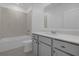 Bathroom with bathtub and grey vanity at 4939 Worchester Dr, Kissimmee, FL 34746