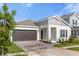 One-story home with a two-car garage and curb appeal at 4939 Worchester Dr, Kissimmee, FL 34746