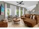 Living room with sectional sofa and TV at 1121 Park Ridge Cir, Kissimmee, FL 34746