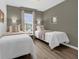 Two twin beds in a bright and airy bedroom at 1121 Park Ridge Cir, Kissimmee, FL 34746