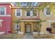 Two-story townhome with inviting front porch and landscaping at 1121 Park Ridge Cir, Kissimmee, FL 34746