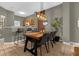 Bright dining room with a long table and modern lighting at 1121 Park Ridge Cir, Kissimmee, FL 34746