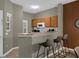 Kitchen features breakfast bar and modern appliances at 1121 Park Ridge Cir, Kissimmee, FL 34746