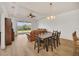 Open concept dining area with table and chairs, view to backyard at 26841 Bella Vista Dr, Howey In The Hills, FL 34737