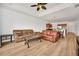Spacious living room with leather sofas and view to the kitchen at 26841 Bella Vista Dr, Howey In The Hills, FL 34737