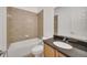 Simple bathroom with single sink, granite countertop and bathtub at 26841 Bella Vista Dr, Howey In The Hills, FL 34737