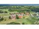 Aerial view of community near golf course and lake at 26841 Bella Vista Dr, Howey In The Hills, FL 34737