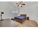 Cozy bedroom with a queen bed, built-in desk and plenty of natural light at 26841 Bella Vista Dr, Howey In The Hills, FL 34737