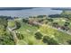 Aerial view showing home location near the lake at 26841 Bella Vista Dr, Howey In The Hills, FL 34737