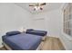 Bedroom with two twin beds, ceiling fan and ample closet space at 26841 Bella Vista Dr, Howey In The Hills, FL 34737