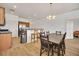 Open concept dining area with dark wood table and chairs at 26841 Bella Vista Dr, Howey In The Hills, FL 34737