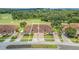 Tan two-story home with double garage and manicured lawn near golf course at 26841 Bella Vista Dr, Howey In The Hills, FL 34737