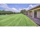 Spacious backyard with access to a golf course at 26841 Bella Vista Dr, Howey In The Hills, FL 34737